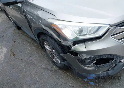 2015 Hyundai Santa Fe Sport 2.4L z USA, uszkodzony, nr VIN 5XYZUDLBXFG255449